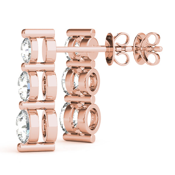 14k gold earrings with three lab-grown diamonds in a vertical design, symbolizing harmony and unity.