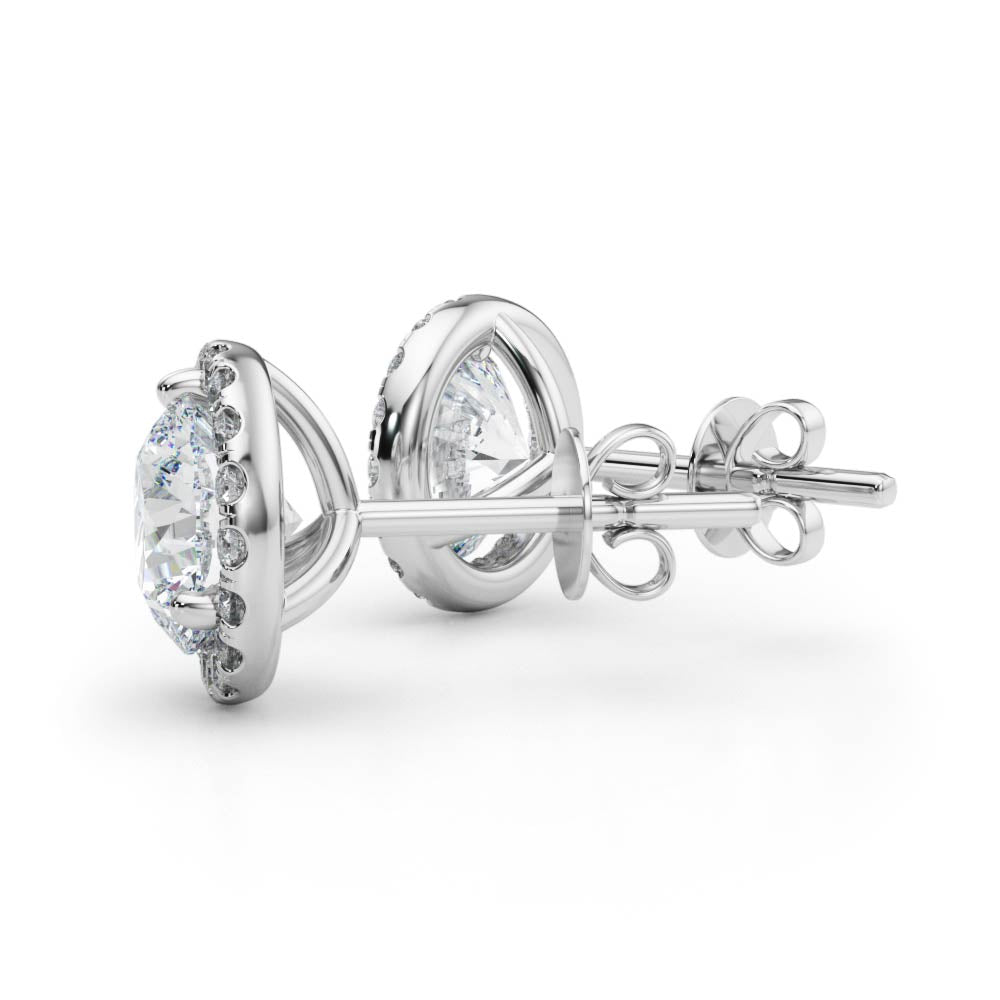 14k white gold halo diamond stud earrings from Lovinity’s Unity Collection, featuring a central Lovinity diamond encircled by smaller diamonds.