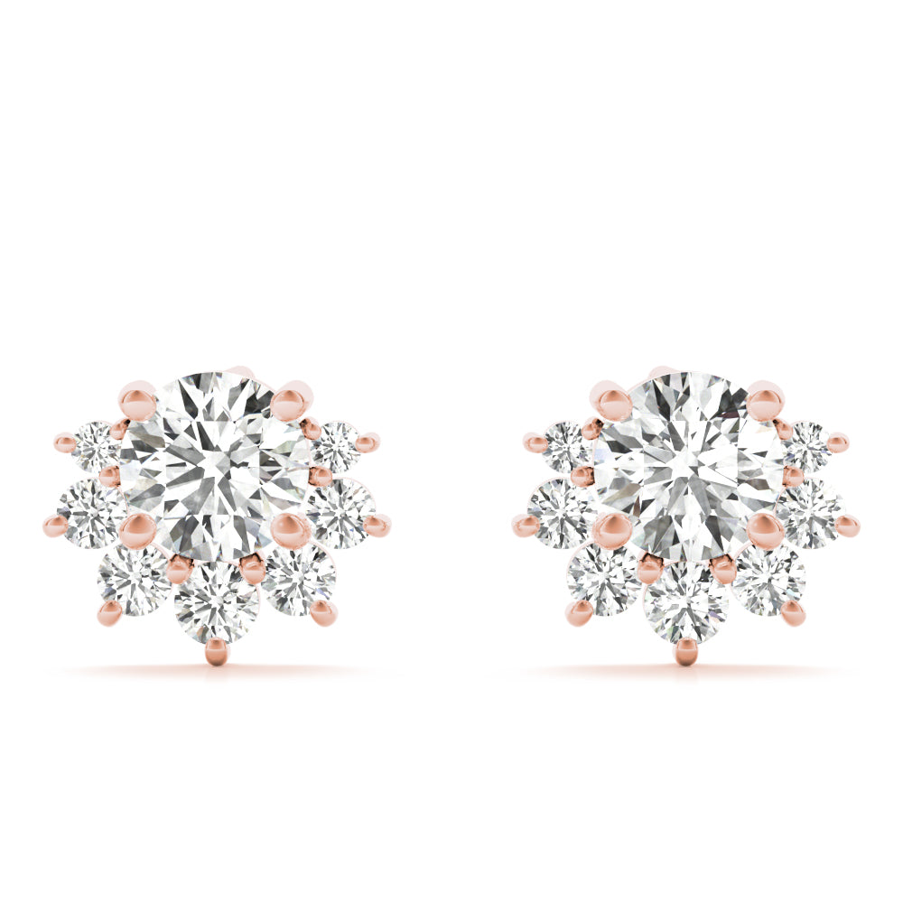 14k gold diamond blossom stud earrings with a central lab-grown diamond and a halo of smaller diamonds in a floral design.