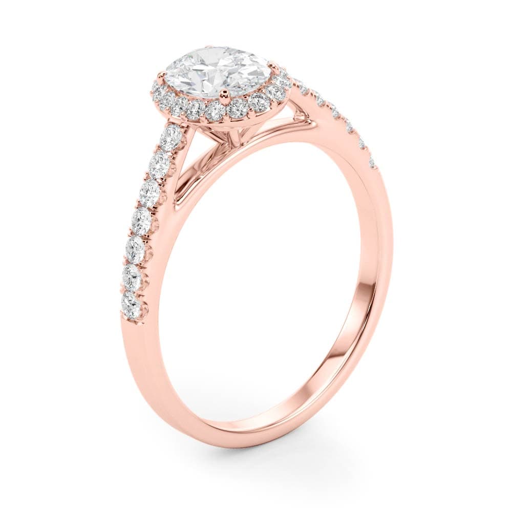 14k gold oval diamond halo engagement ring with pavé-set diamonds symbolizing eternal love.