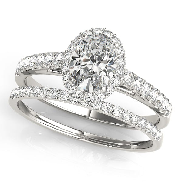 14k gold oval diamond halo engagement ring with pavé-set diamonds symbolizing eternal love.
