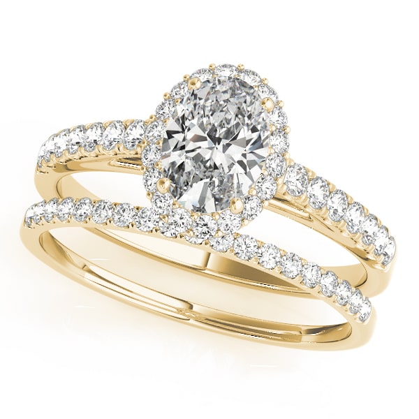 14k gold oval diamond halo engagement ring with pavé-set diamonds symbolizing eternal love.