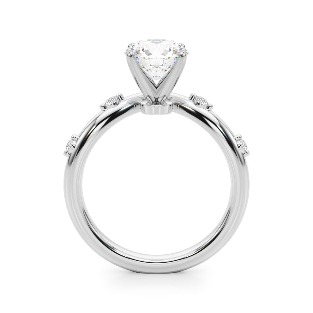 14k gold vine-inspired engagement ring with a round-cut lab-grown diamond center and delicate diamond accents along the band.