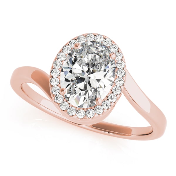 Oval halo lab-grown diamond ring in 14k gold with smaller diamonds encircling the center stone.