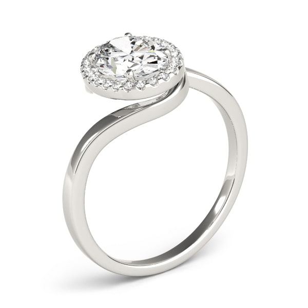 Oval halo lab-grown diamond ring in 14k gold with smaller diamonds encircling the center stone.