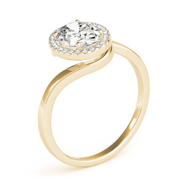 Oval halo lab-grown diamond ring in 14k gold with smaller diamonds encircling the center stone.