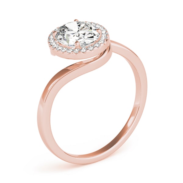 Oval halo lab-grown diamond ring in 14k gold with smaller diamonds encircling the center stone.
