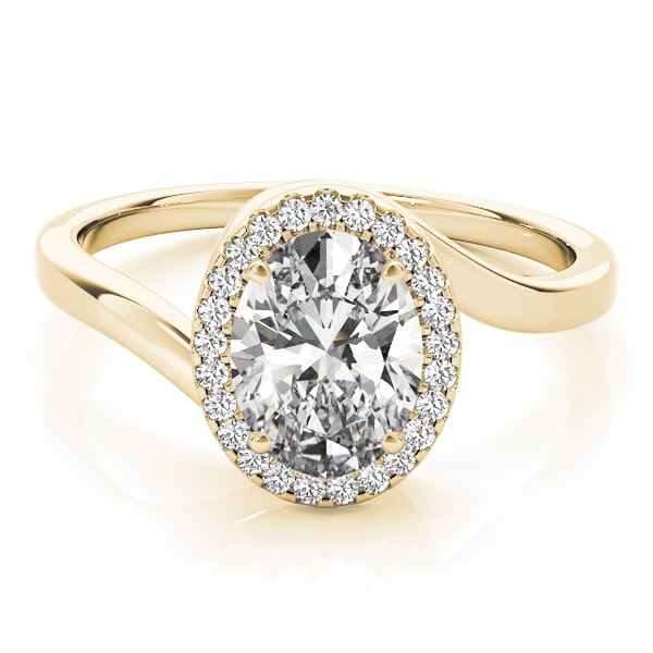 Oval halo lab-grown diamond ring in 14k gold with smaller diamonds encircling the center stone.
