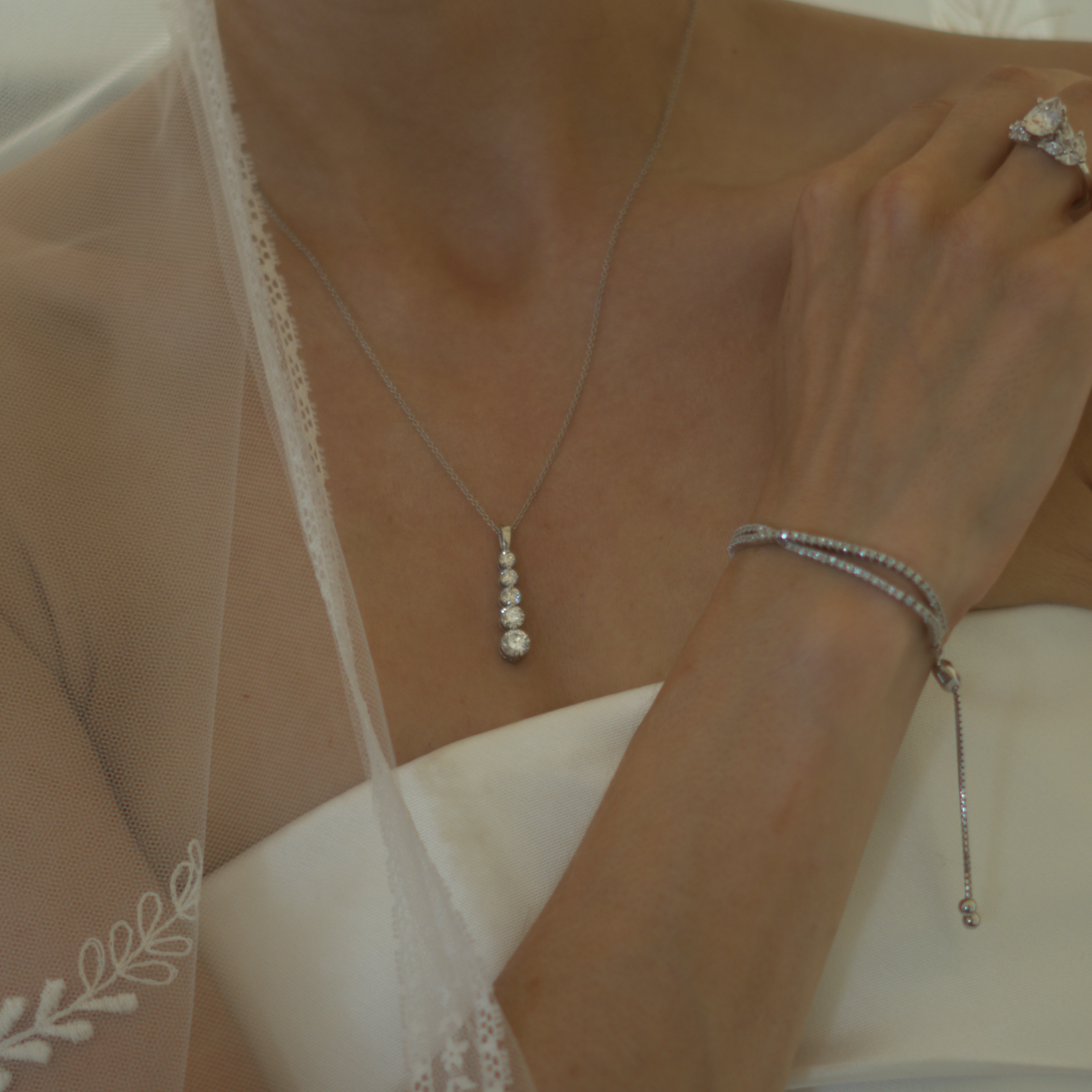 14k rose gold pendant with a vertical arrangement of lab-grown diamonds, symbolizing connection and harmony.