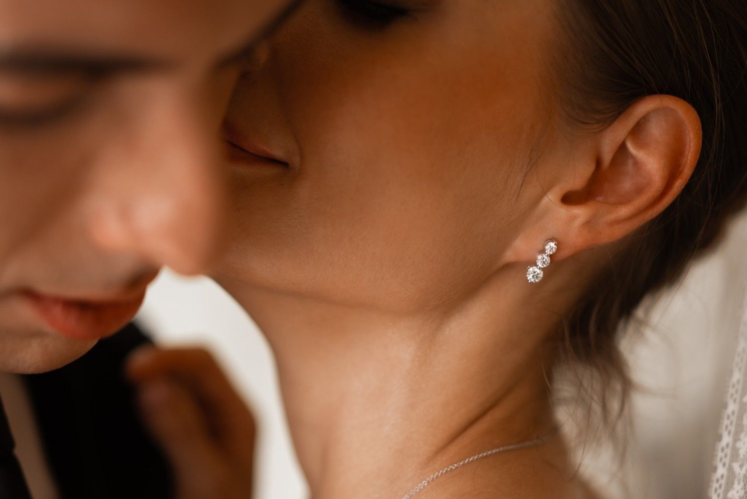 14k gold earrings with three lab-grown diamonds in a vertical design, symbolizing harmony and unity.