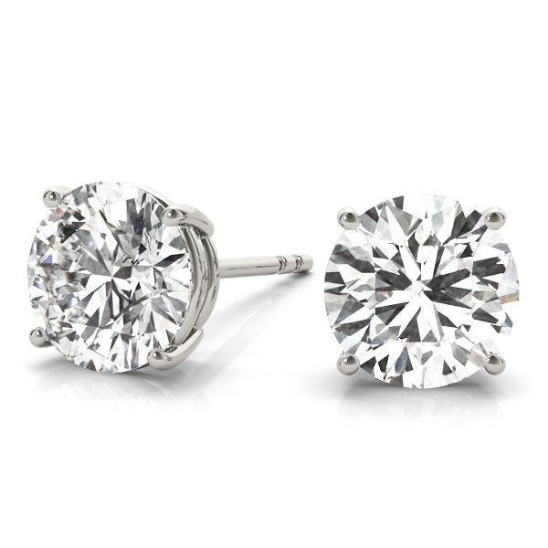 14k white gold diamond stud earrings featuring two round Lovinity diamonds in a four-prong setting. Minimalist, elegant, and versatile jewelry piece.