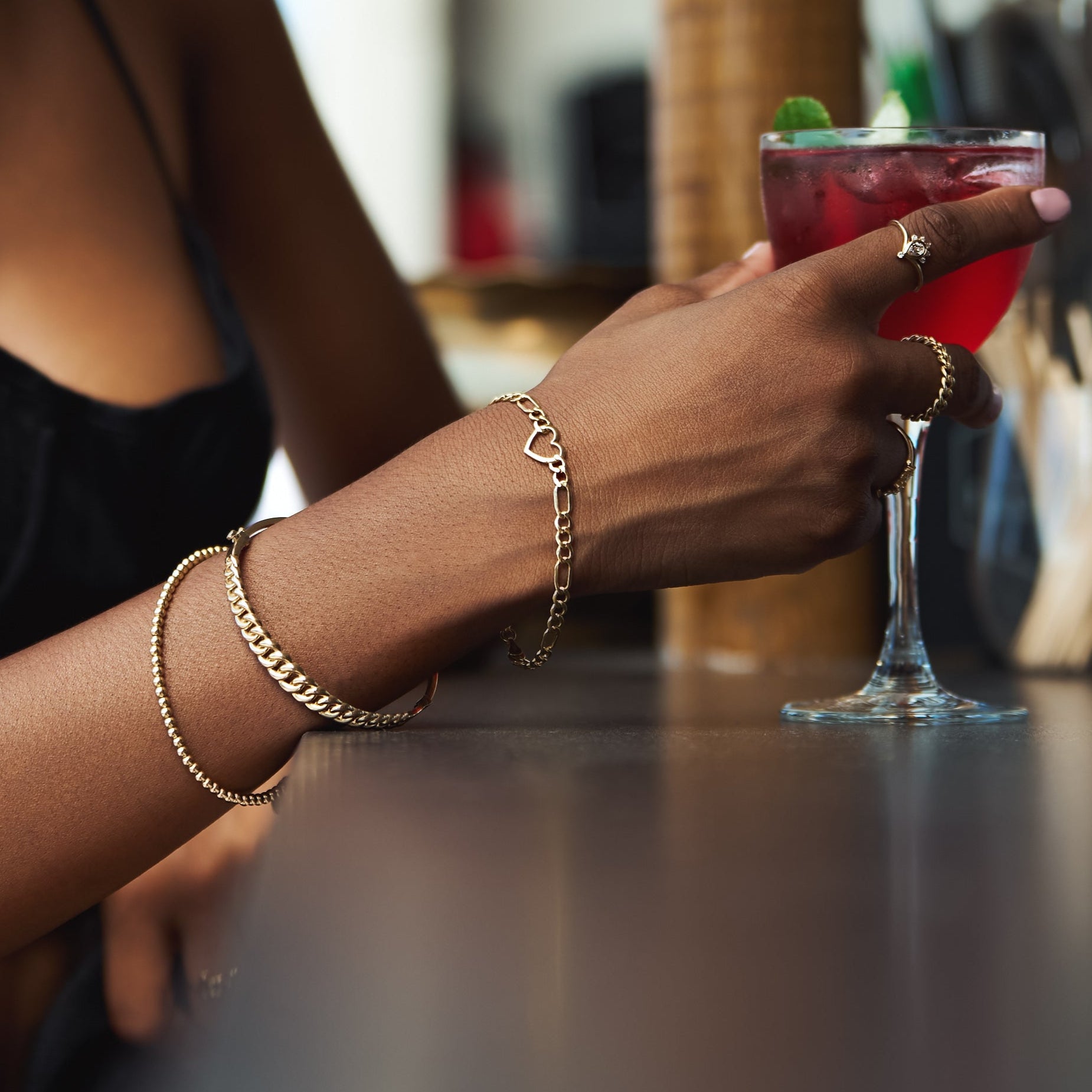 14k gold beaded cuff bracelet, representing modern elegance and minimalist sophistication.