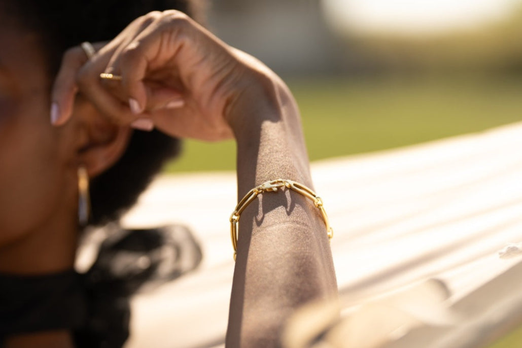 14k gold rectangular link bracelet, representing strength, unity, and modern elegance.