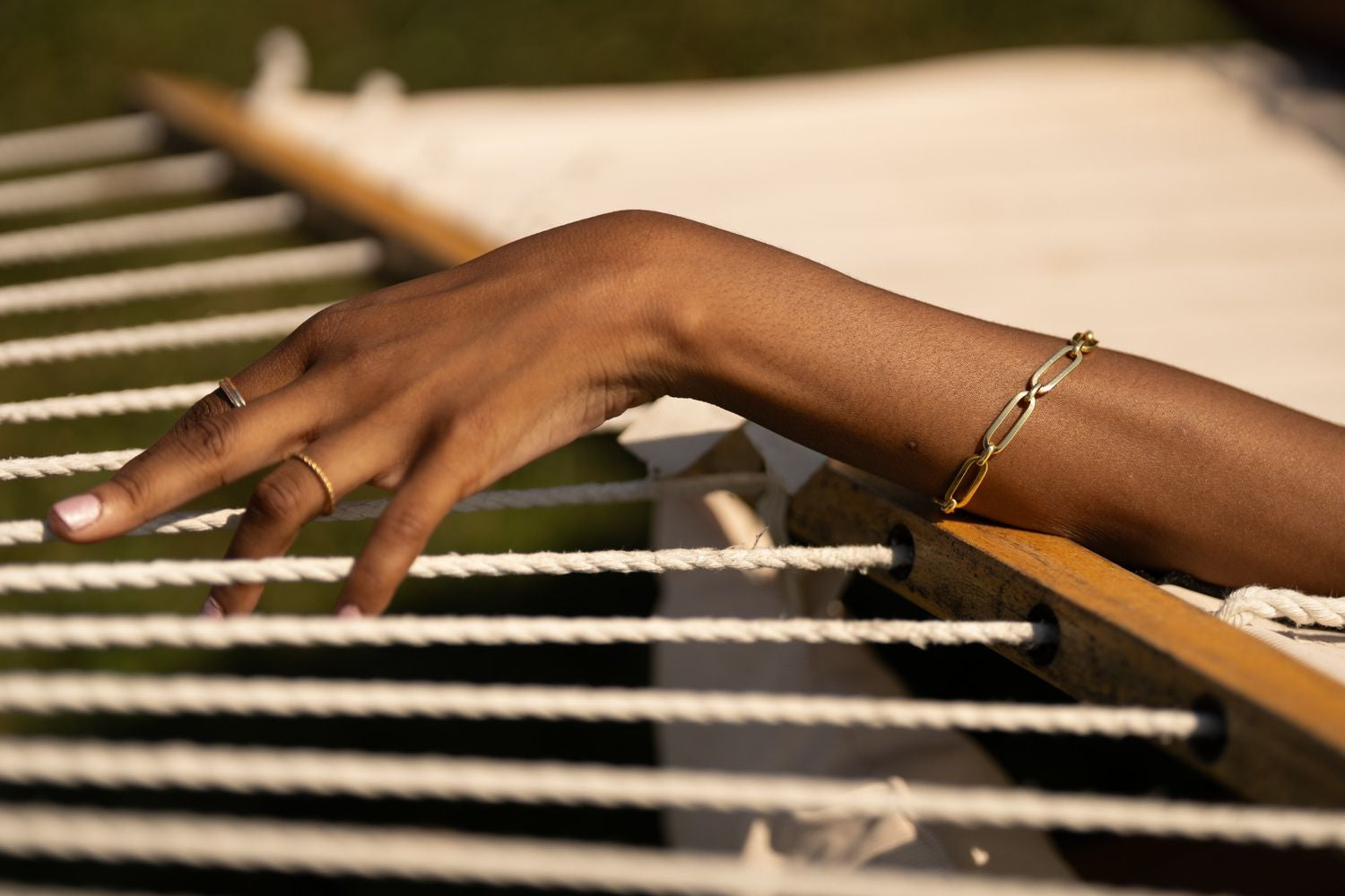 14k gold rectangular link bracelet, representing strength, unity, and modern elegance.