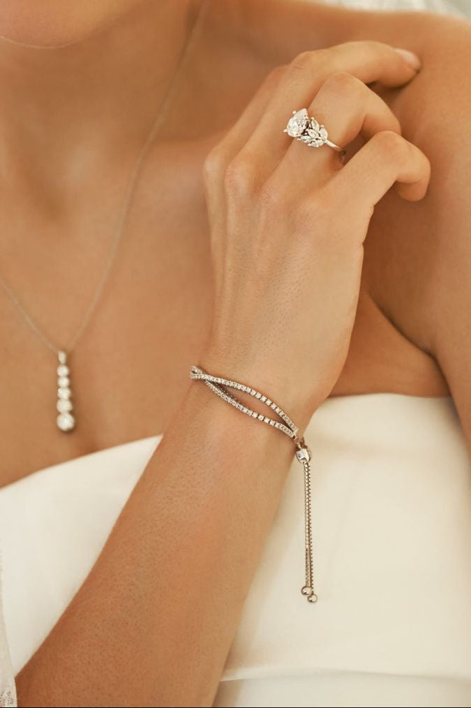 14k rose gold dual-row diamond bracelet with adjustable slider clasp, exuding luxury and sophistication.