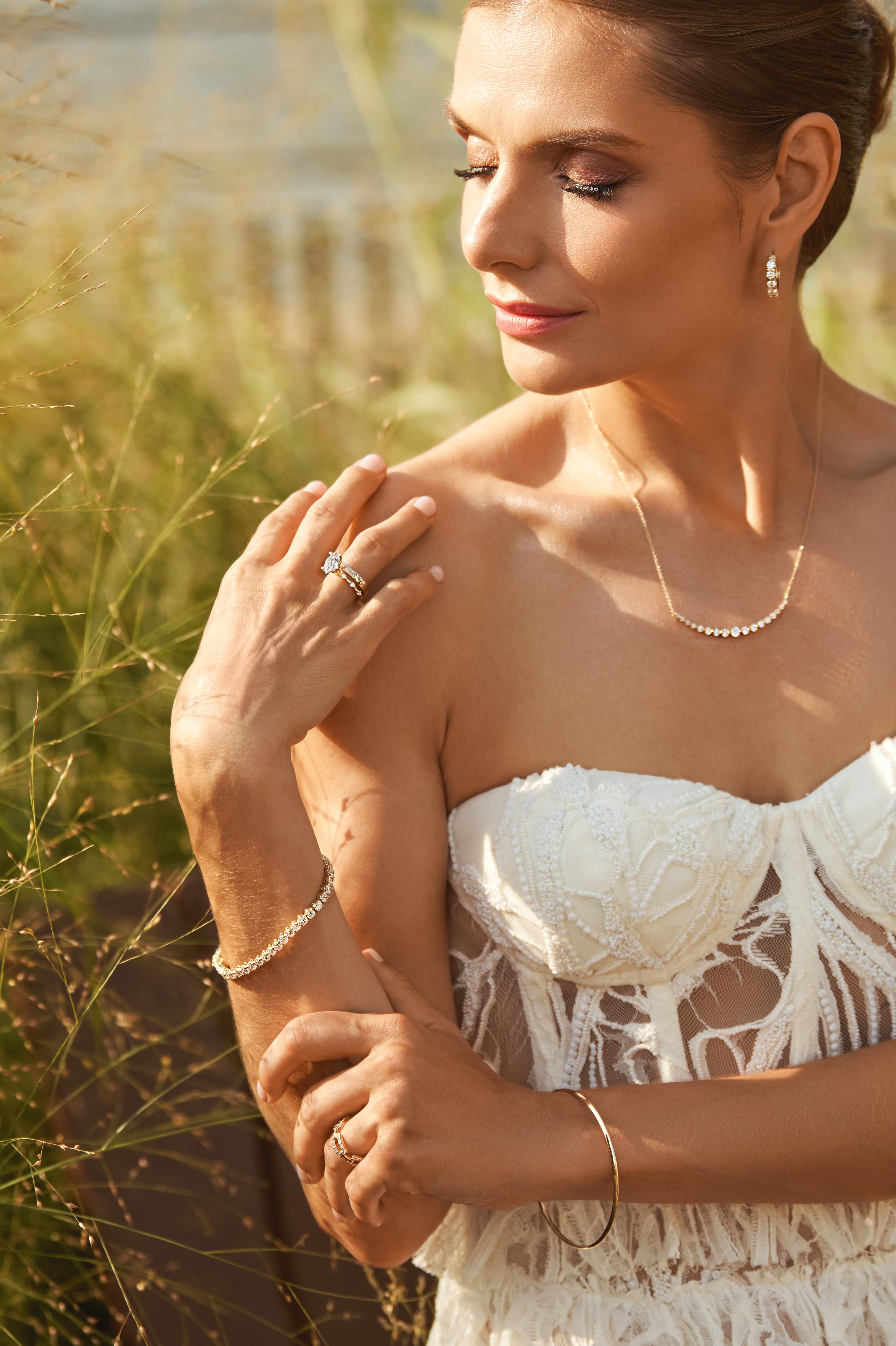 14k yellow gold Infinite Grace Ring featuring a marquise-cut Lovinity diamond and round diamonds set along the band.