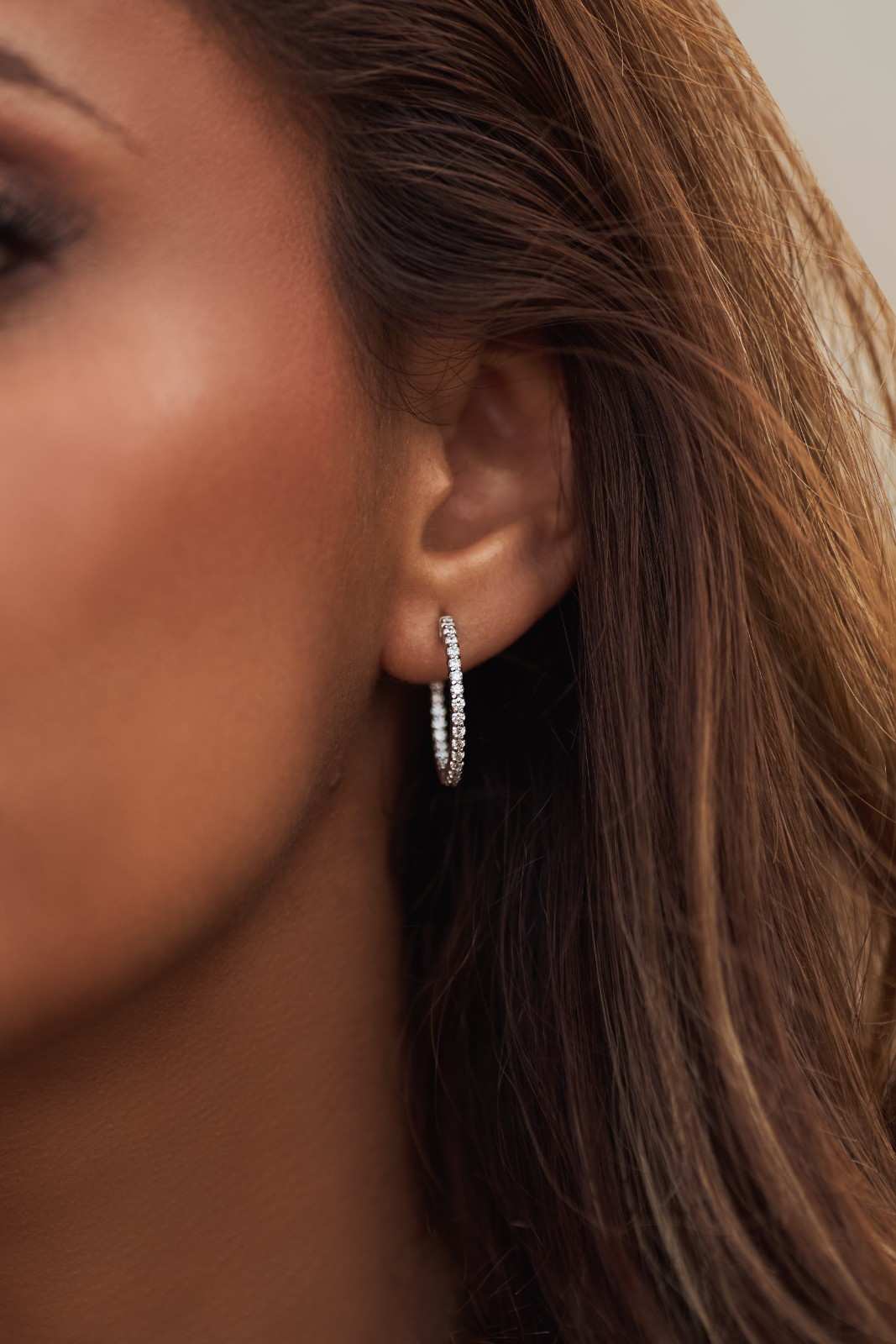 14k white gold inside-out hoop earrings with lab-grown diamonds, symbolizing infinity and timeless elegance.