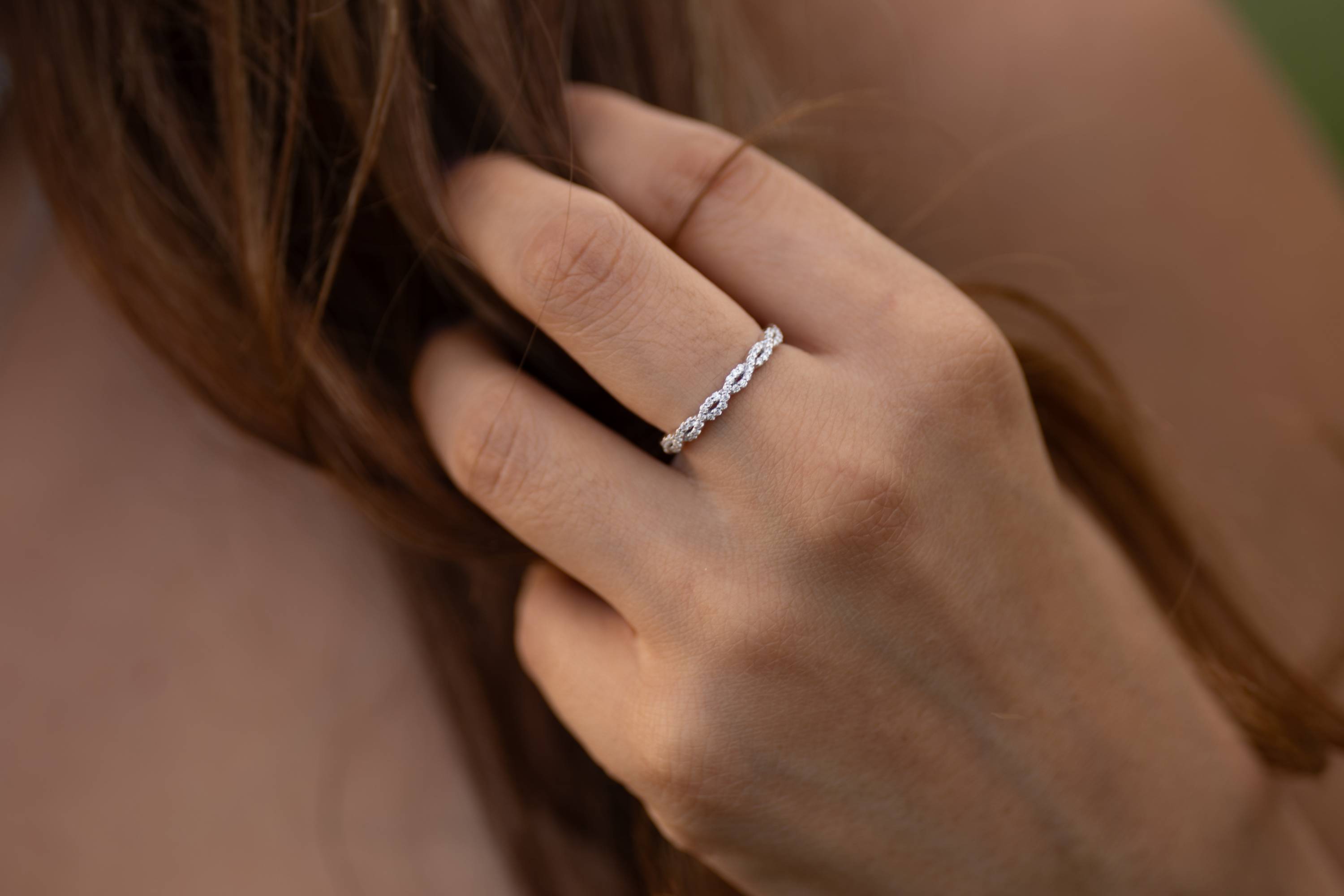 14k gold marquise-shaped diamond eternity band symbolizing unity and love.