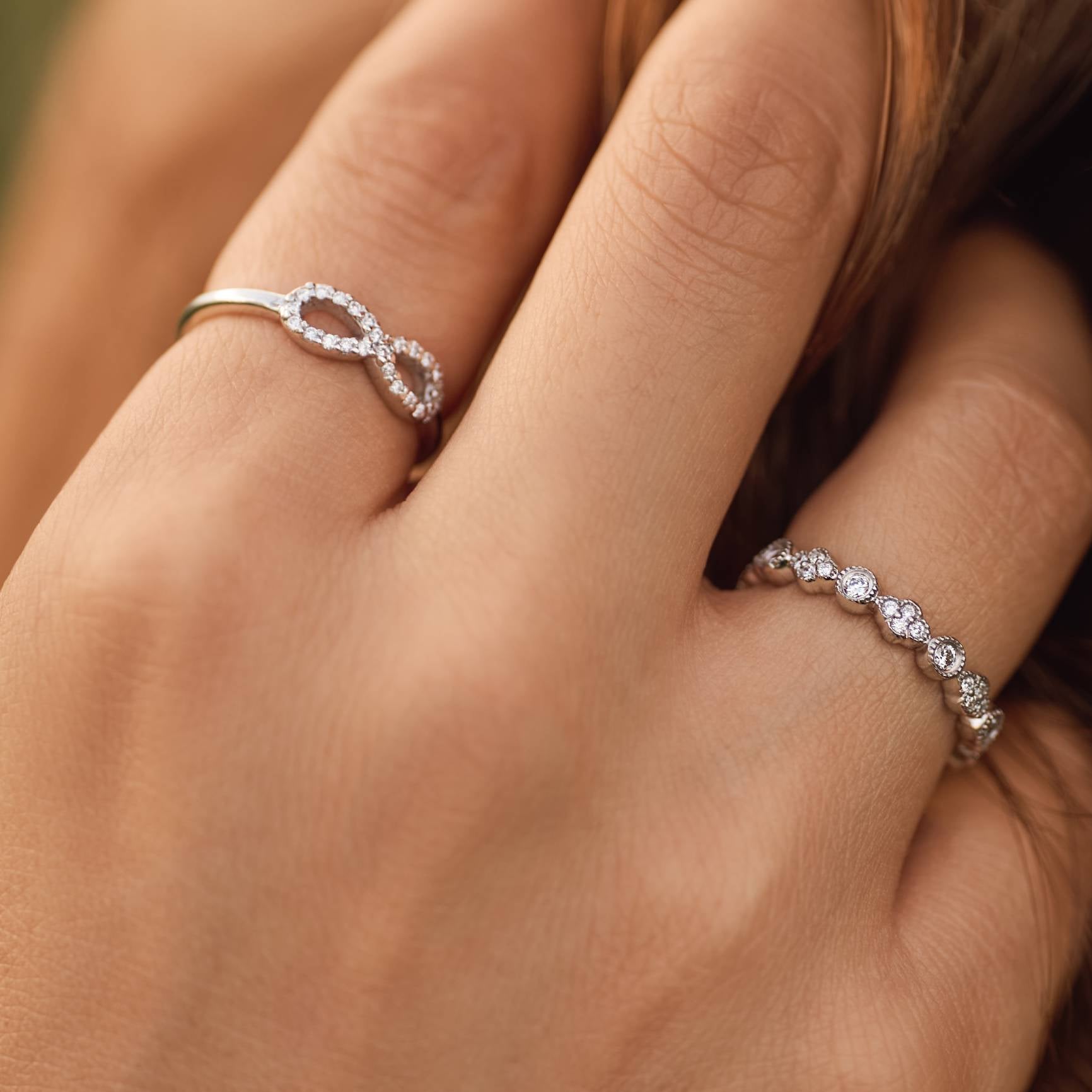 Elegant Infinite Love Diamond Ring with an infinity symbol design.