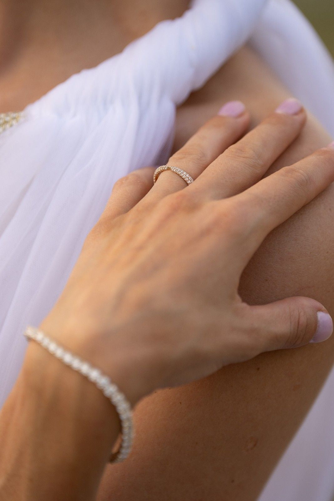 14k gold crossover diamond band featuring lab-grown diamonds, symbolizing unity and protection.