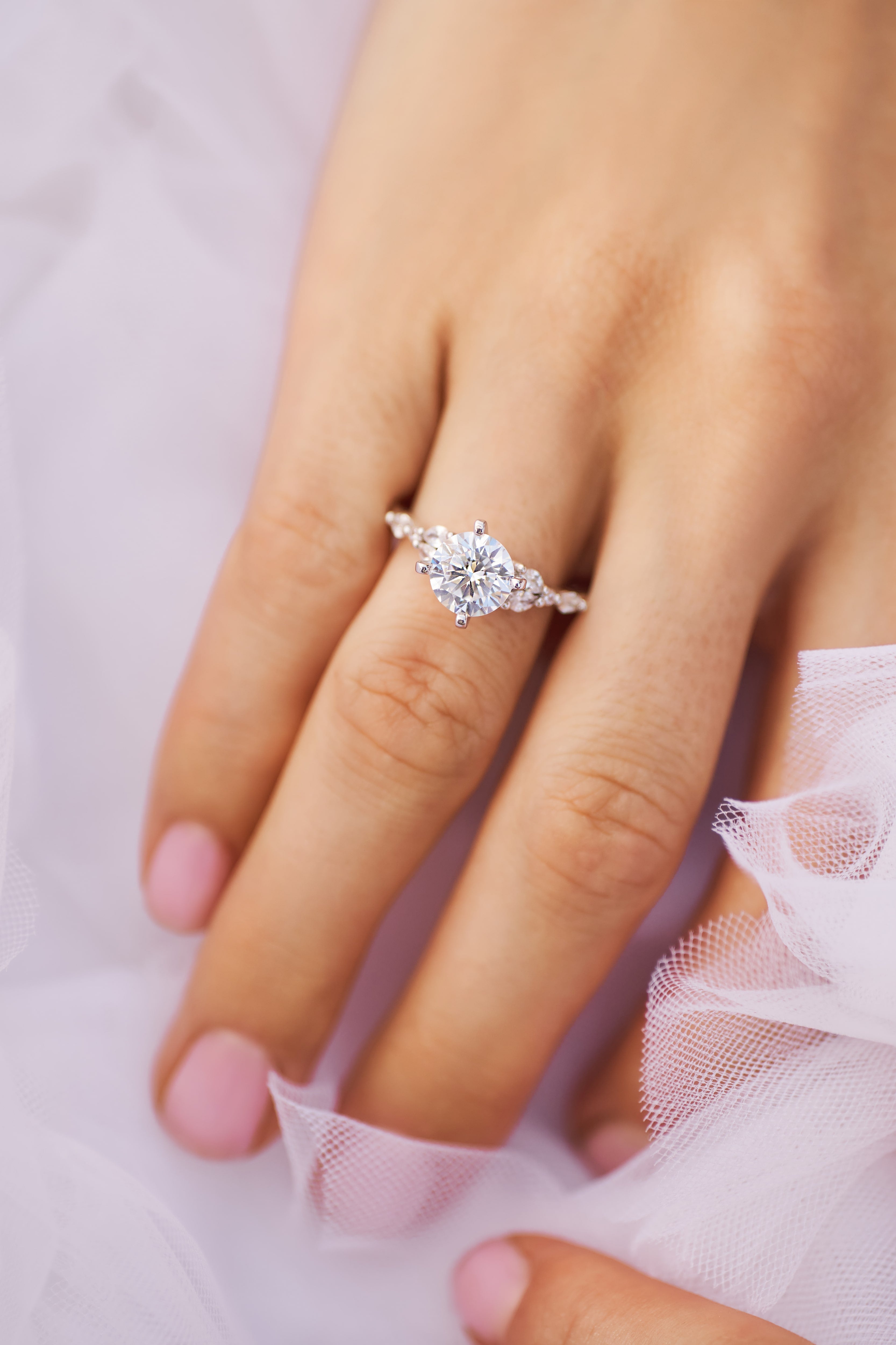 Infinity vine design diamond engagement ring in 14k gold with lab-grown diamonds wrapping around the finger.