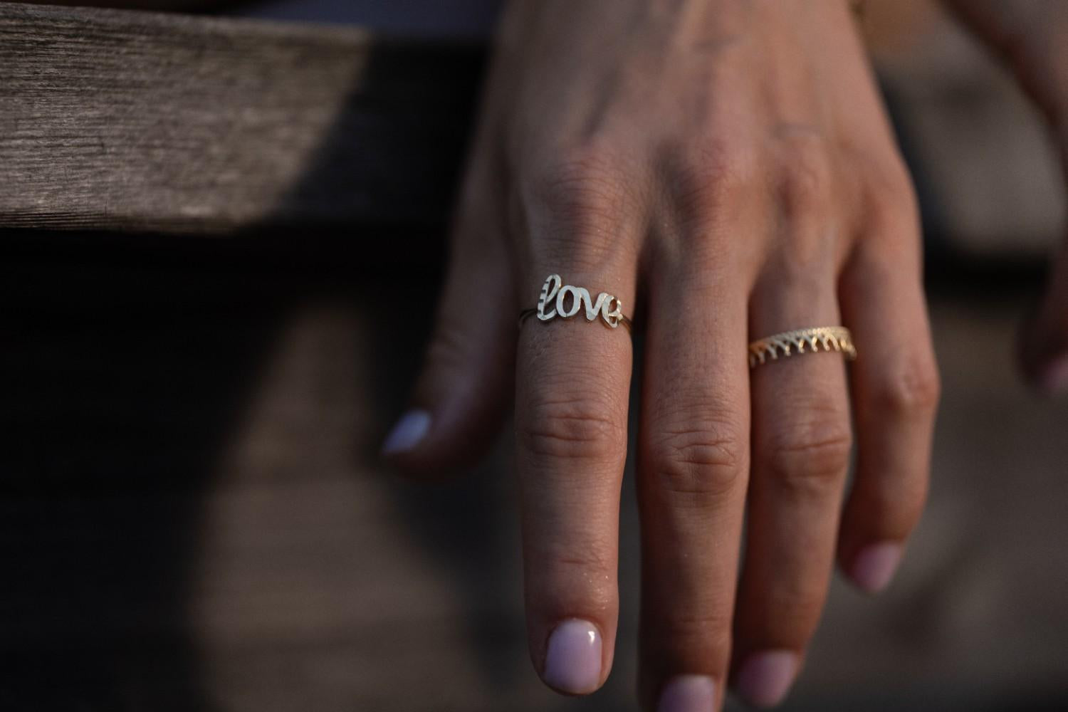 14k Gold Love Script Ring featuring an elegant script design spelling "Love," symbolizing affection and connection.