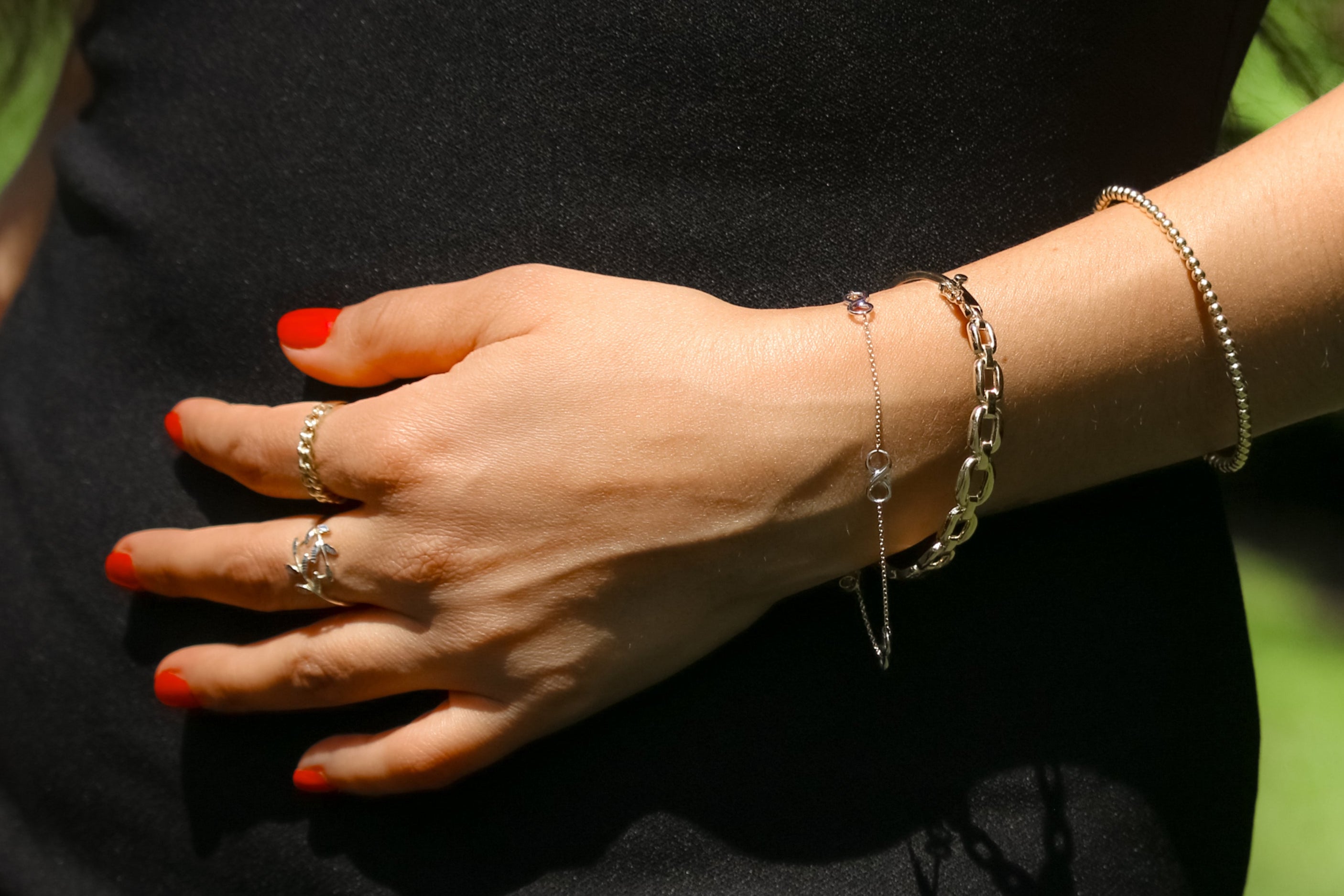 Gold bracelet featuring interlinked infinity symbols, representing eternal love and unity.