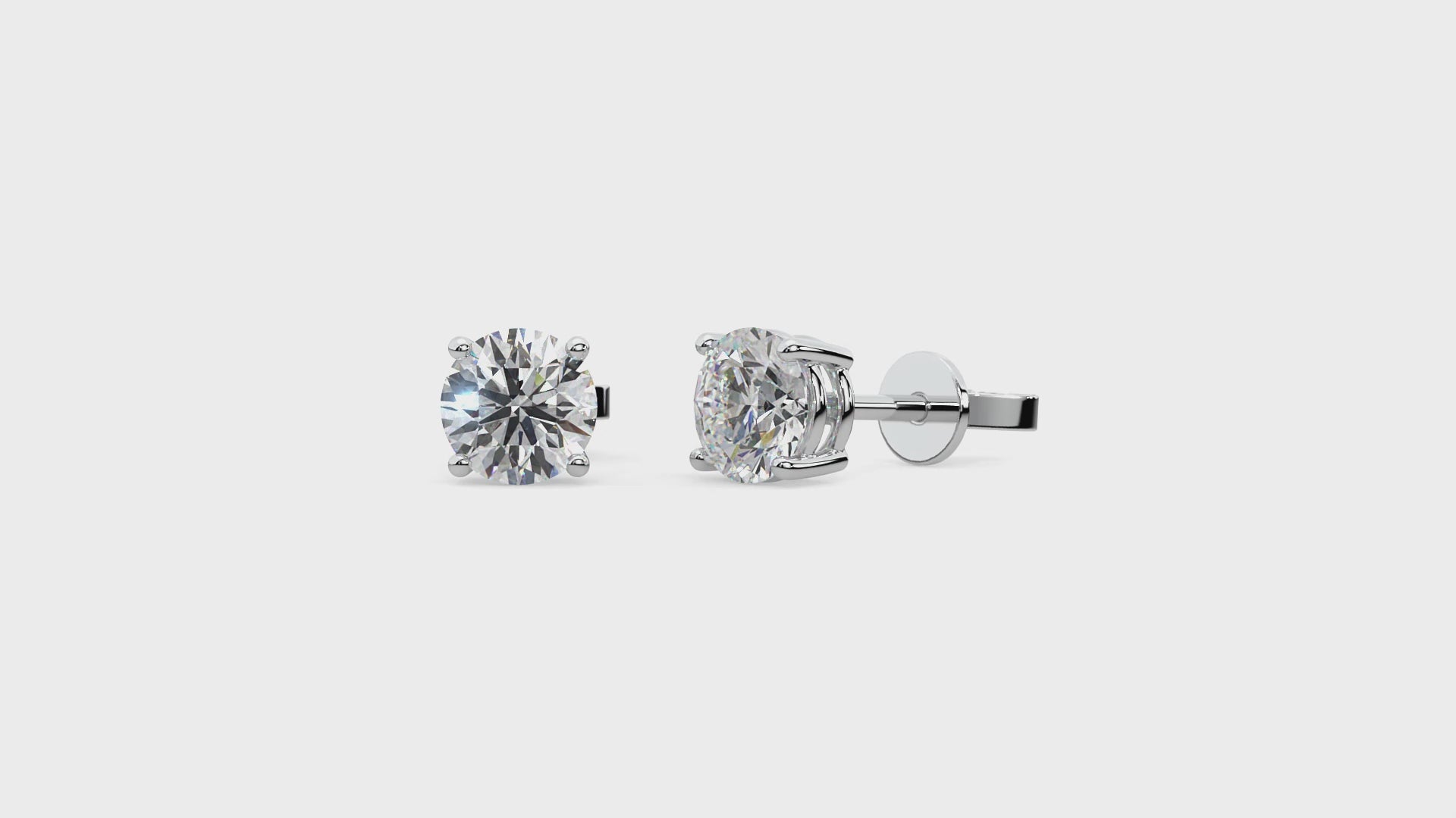 14k gold round diamond stud earrings with lab-grown diamonds in a classic four-prong setting, offering timeless elegance.