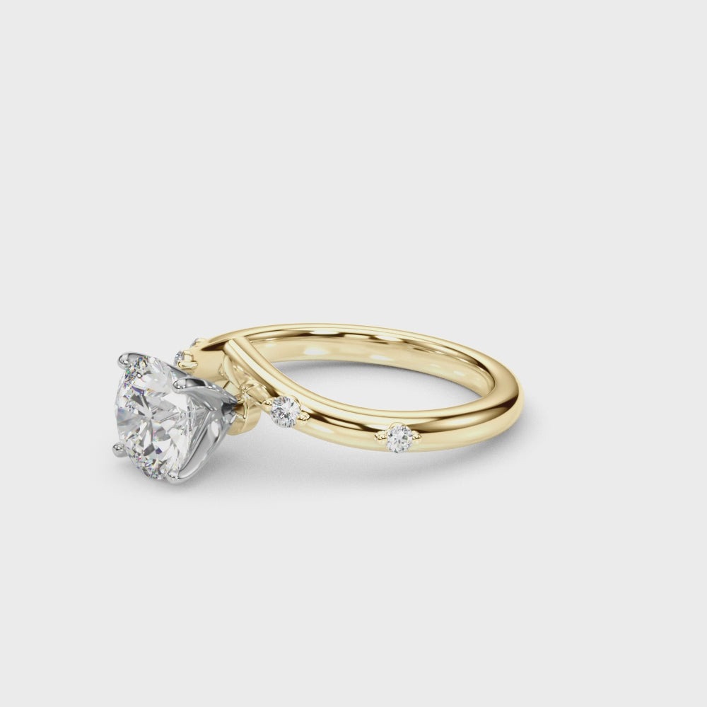 14k gold vine-inspired engagement ring with a round-cut lab-grown diamond center and delicate diamond accents along the band.