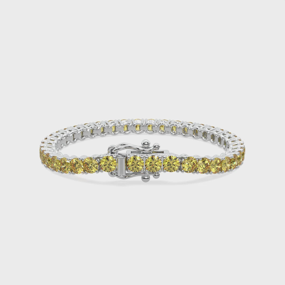 Elegant yellow diamond bracelet in 14k gold with minimalist arc design.
Luminous Arc Bracelet featuring yellow lab-grown diamonds in a sleek 4-prong setting.  Radiant tennis bracelet with yellow diamonds symbolizing warmth and connection.