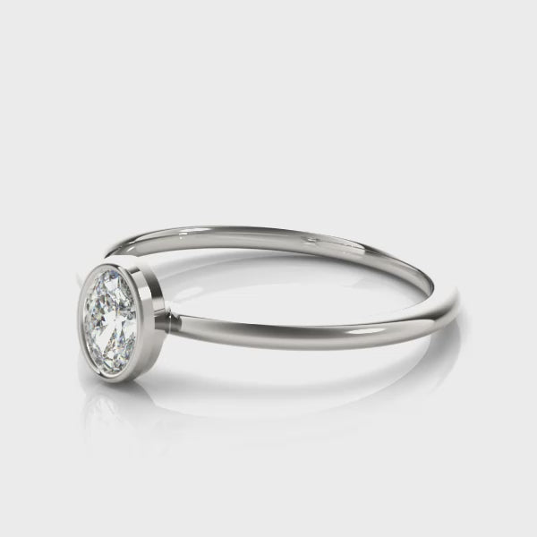 14k gold oval-cut diamond ring with a bezel setting, symbolizing unity and protection.