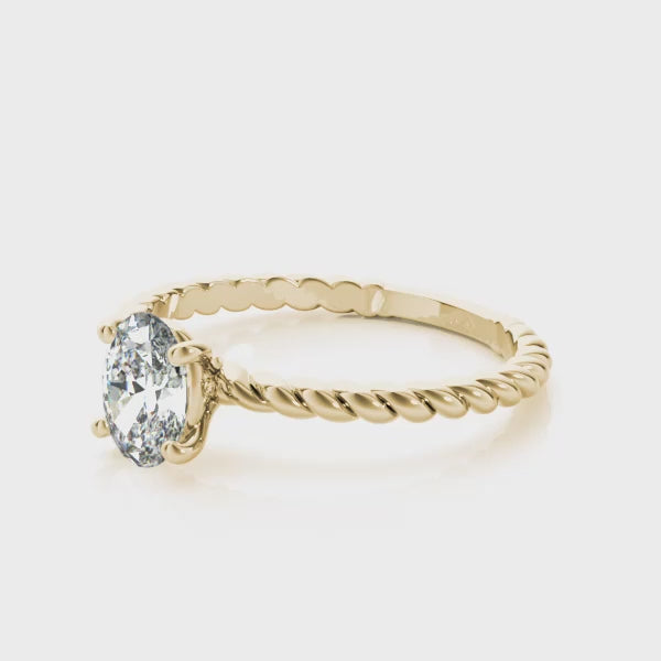 14k gold braided solitaire diamond ring featuring a central lab-grown diamond.