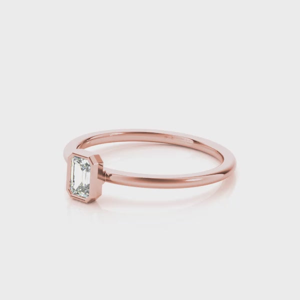 14k Gold Emerald-Cut Lab-Grown Diamond Ring in Bezel Setting.