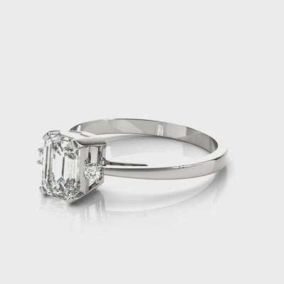 14k gold emerald cut diamond three-stone engagement ring featuring lab-grown diamonds.