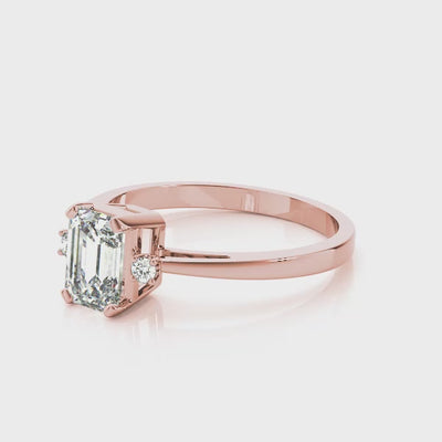 14k gold emerald cut diamond three-stone engagement ring featuring lab-grown diamonds.